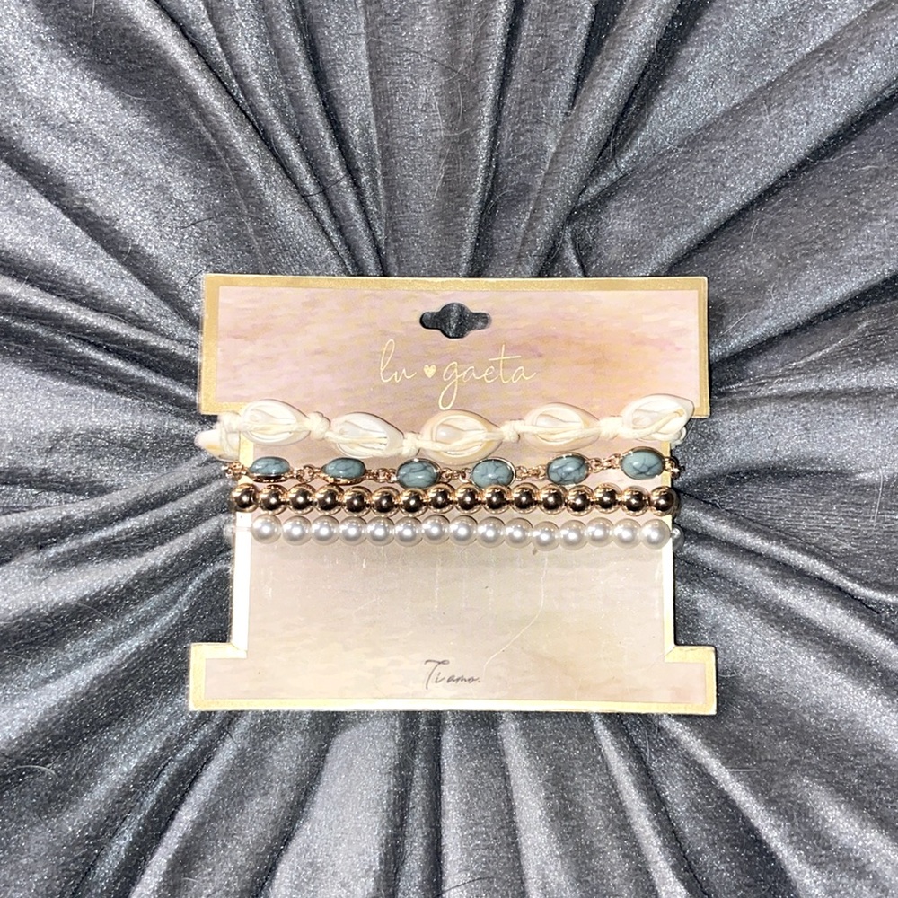 Gold charm set bracelets